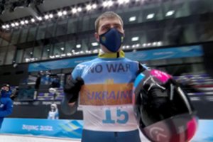 Pekino žaidynėse Ukrainos olimpiečiai prašo taikos, bet Rusijos nemini