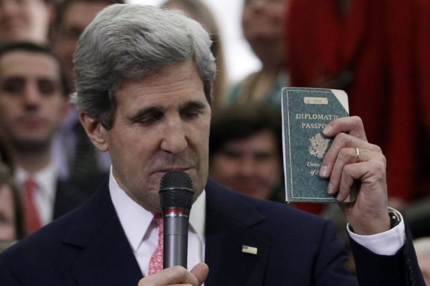 J. Kerry pademonstravo nučiurusį savo pirmąjį diplomatinį pasą, išduotą, kai jam tebuvo 11 metų, o jo tėvas diplomatas dirbo Berlyne.