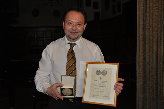 Dirigentui A.Pečiuliui – austrų medalis už šimtametės tradicijos saugojimą