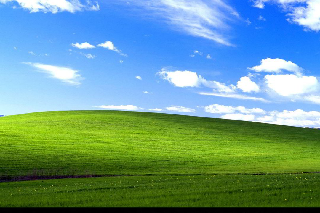 Tradicinis „Windows XP“ darbalaukio fonas, kurį pirmiausia išvysdavo visi, įsidiegę 2001 m. pristatytą operacinę sistemą.<br>„Microsoft“ nuotr.