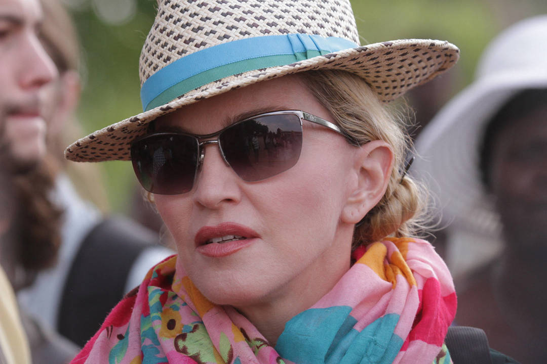 Malavyje Madonna vieši kartu su savo atžalomis.<br>AP nuotr.