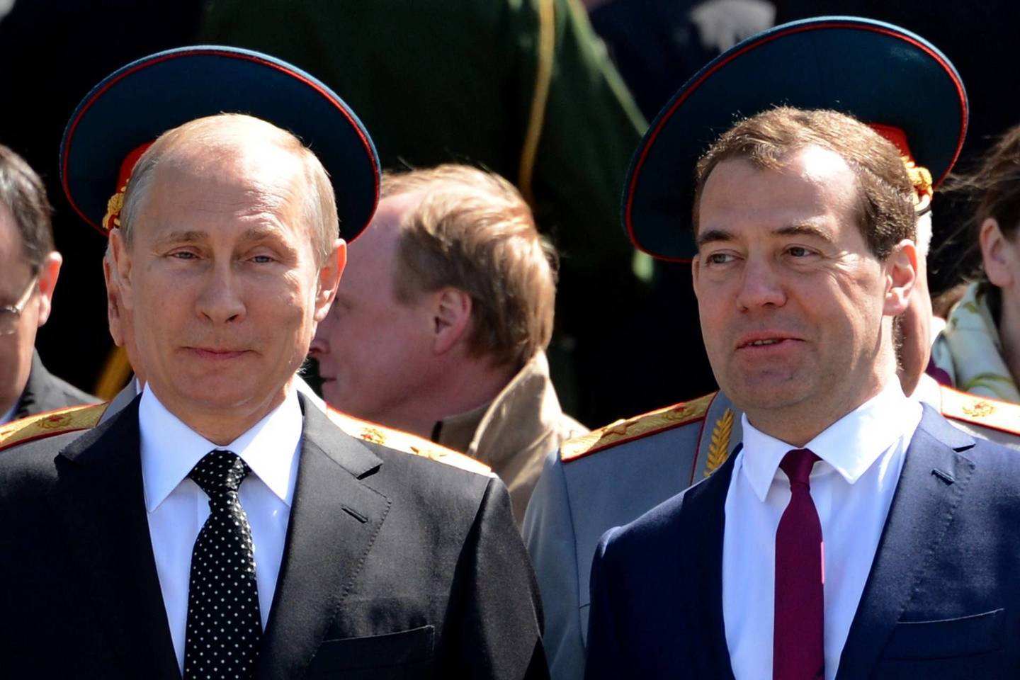 Vladimiras Putinas ir Dmitrijus Medvedevas.<br>AFP nuotr.