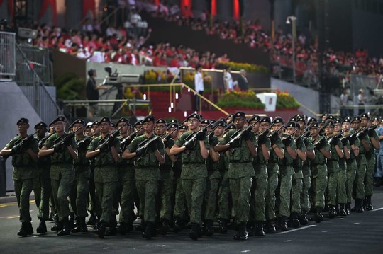 Singapūro gyventojai švenčia šalies pusės amžiaus jubiliejų.<br>AFP/Scanpix nuotr.