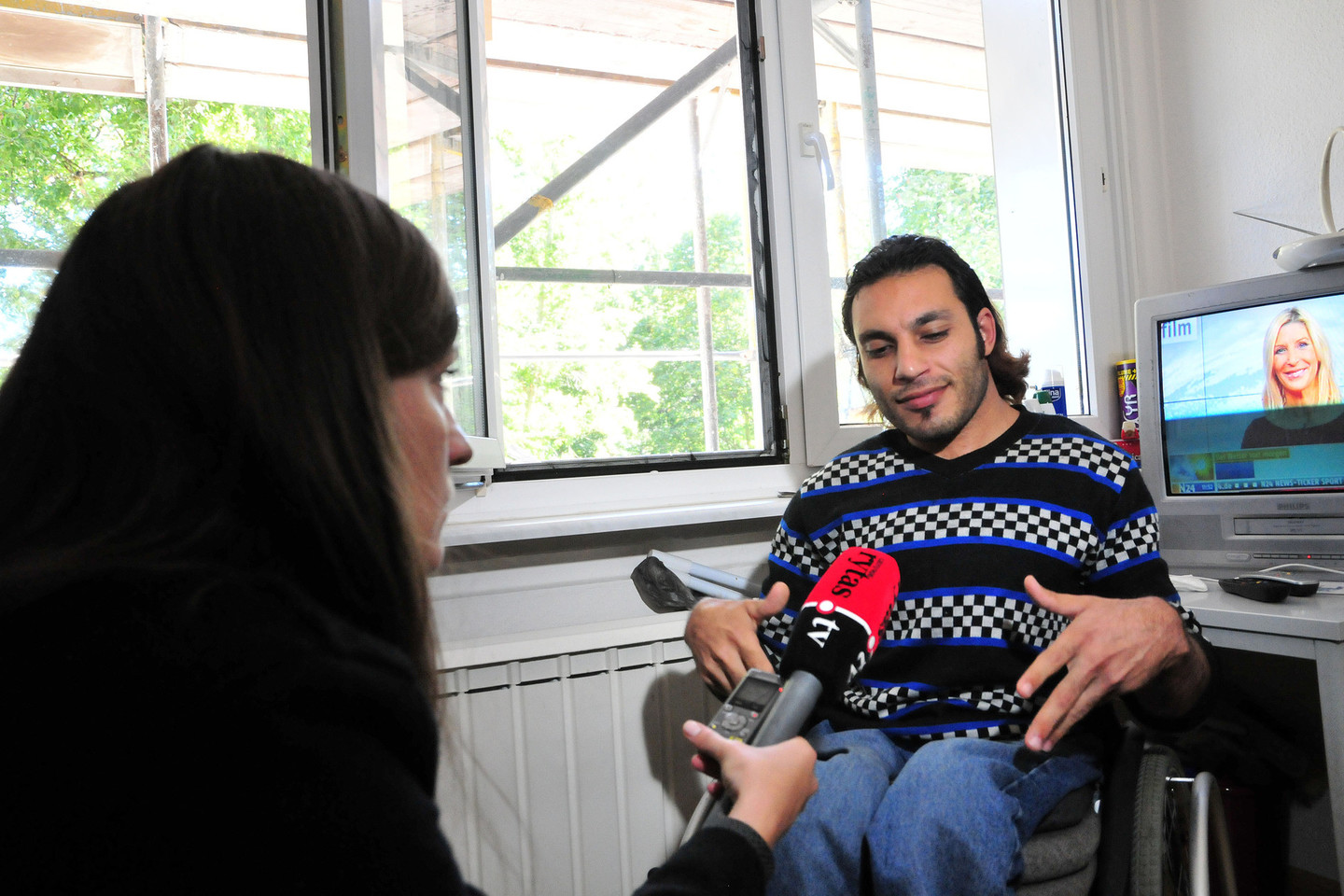 Neįgaliojo vežimėlyje iš Sirijos keliavęs Zaheras Alsakka dabar į Vokietiją trokšta atsigabenti ir savo šeimą.<br>A.Vaitkevičiaus nuotr.