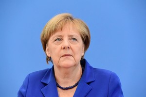 Angela Merkel atsisakė keisti pabėgėlių politiką