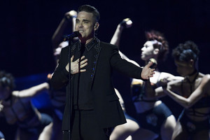 Robbie Williamsas paviešino koreguotą Lietuvos prezidentūros nuotrauką