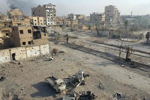 Atsakomąjį puolimą surengę „Islamo valstybės“ džihadistai susigrąžino dalį Sirijos pasienio miesto