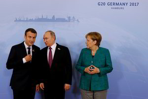 V. Putinas, E. Macronas ir A. Merkel sutarė operatyviau mainytis informacija apie Siriją