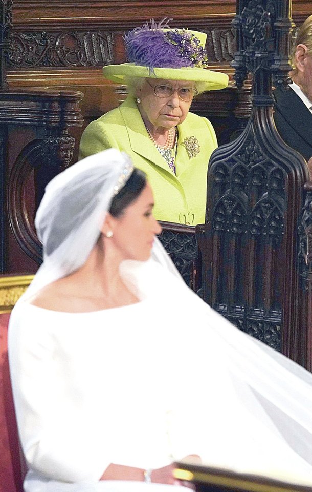 Karalienei Elizabeth II patinka Meghan.<br>AP ir „Scanpix” nuotr.
