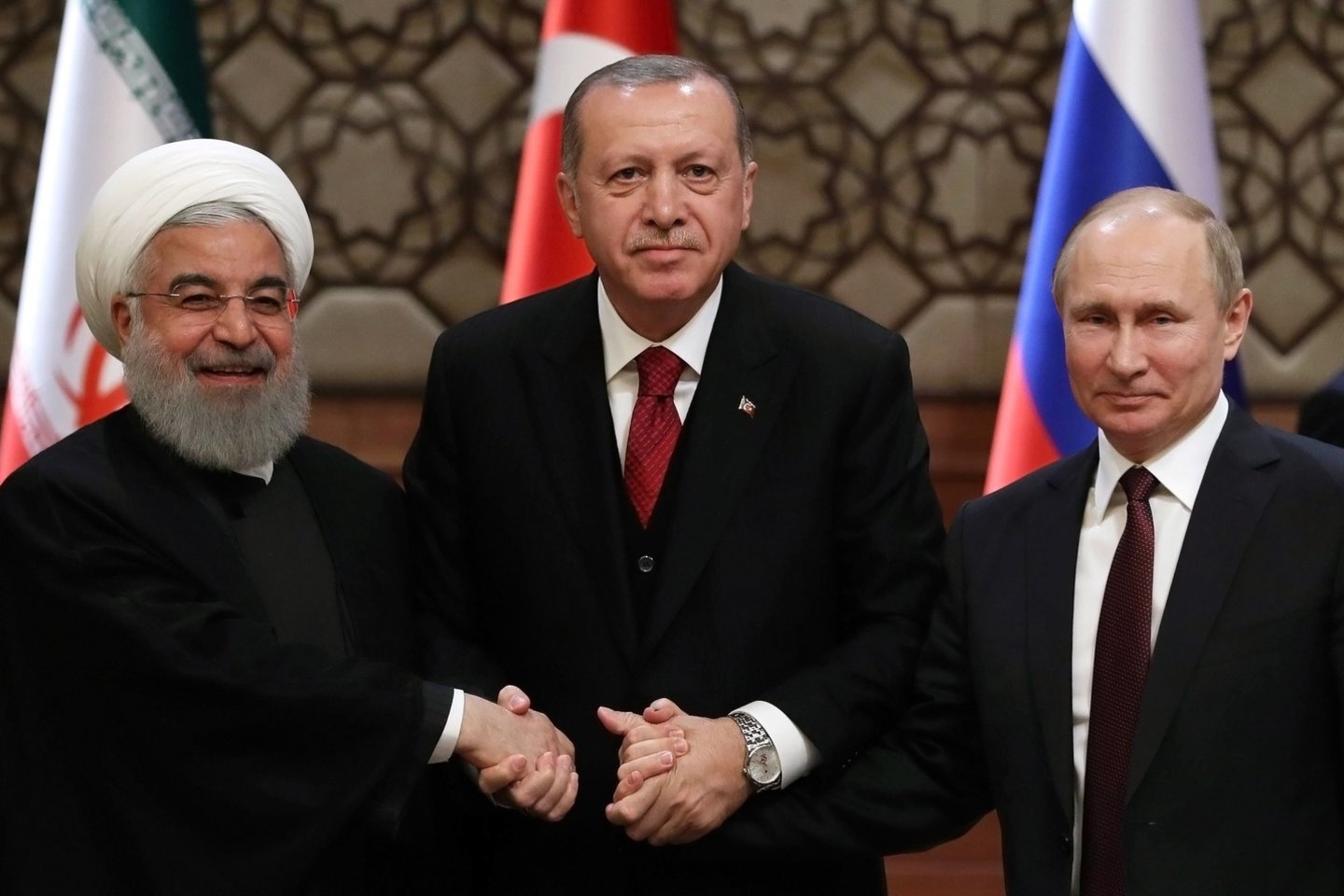 Irano prezidentas Hassanas Rouhani, Turkijos prezidentas Recepas Tayyipas Erdoganas ir Rusijos vadovas Vladimiras Putinas.