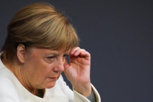 A. Merkel kaltina Kiniją žiauriu elgesiu su mažumų atstovais