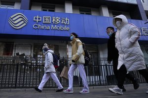 Kinijoje dėl viruso protrūkio uždaryti du miestai