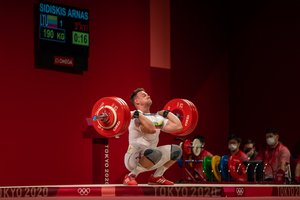 Roko muzikos įsiūbuotame olimpiniame laive sunkiaatletis A. Šidiškis šypsojosi: „Savo planą įvykdžiau“