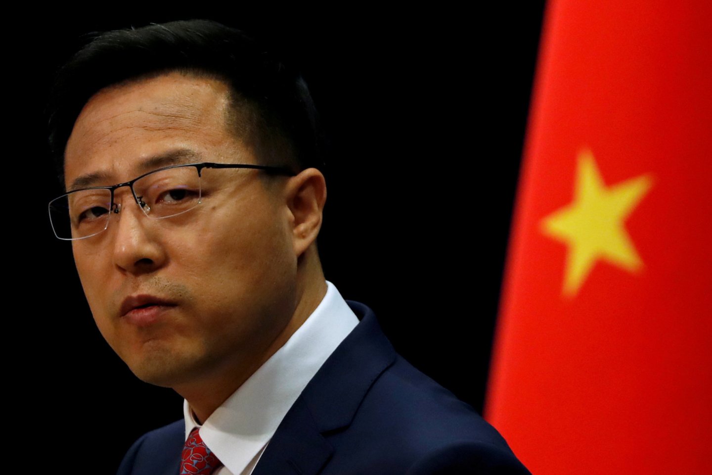 Kinijos užsienio reikalų ministerijos atstovas Zhao Lijianas.<br>Reuters/Scanpix nuotr.