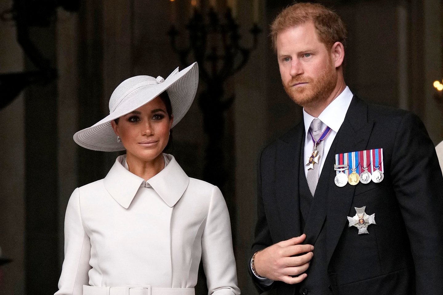  Princas Harry ir Meghan Markle. <br> Scanpix/ AFP nuotr.