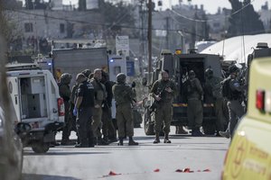 Po įtariamos atakos Izraelio kariai nušovė palestinietį