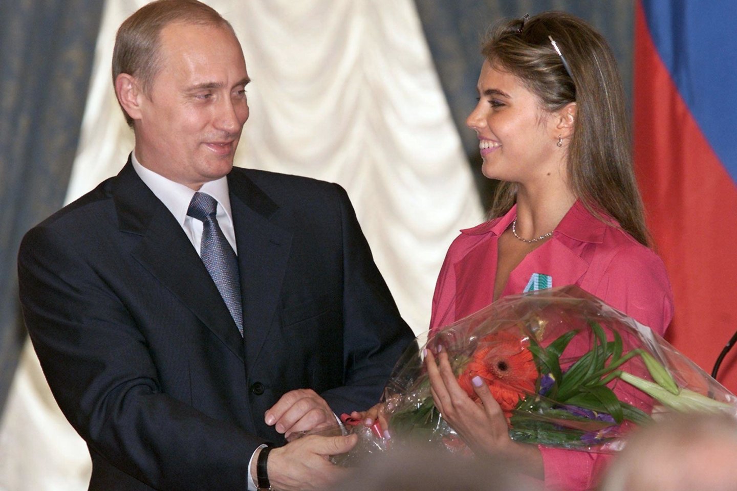  Vladimiras Putinas ir Alina Kabajeva.<br> AFP/Scanpix nuotr.