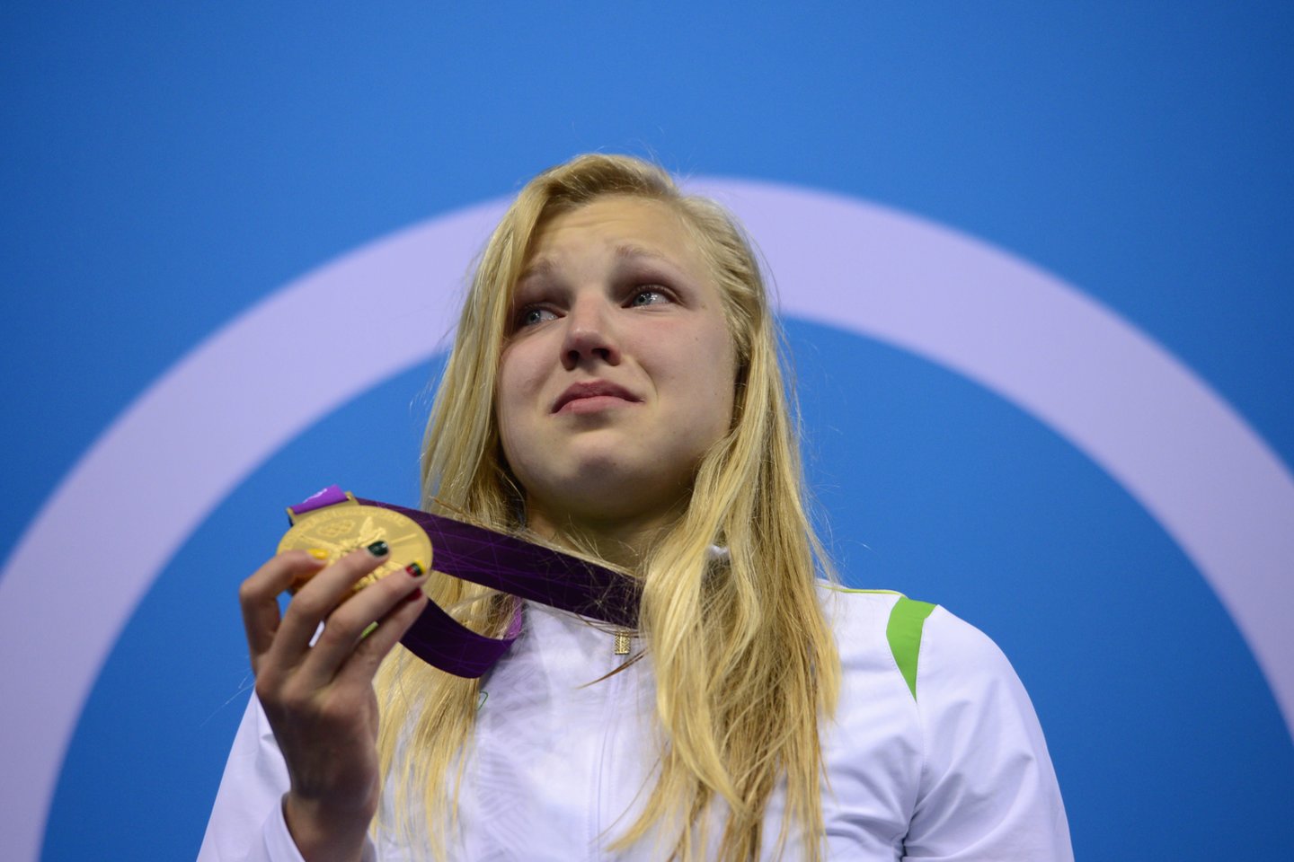 Rūta Meilutytė iškovojo aukso medalį 2012 m. Londono olimpinėse žaidynėse.<br>AFP/Scanpix nuotr.