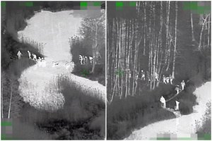 Pasieniečių sraigtasparnis virš Čepkelių raisto išbaidė didelę migrantų grupę – nekviesti svečiai skubiai grįžo į Baltarusiją