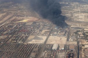 Iranas pranešė, kad pražūtingo sprogimo svarbiame uoste sukeltą gaisrą pavyko suvaldyti