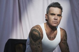 Vasarą Lietuvoje koncertą surengsiantis Robbie Williams pristato ypatingą naujieną