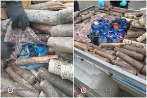 Jurbarko pareigūnai aptiko malkų krovinyje gabentą naminę degtinę