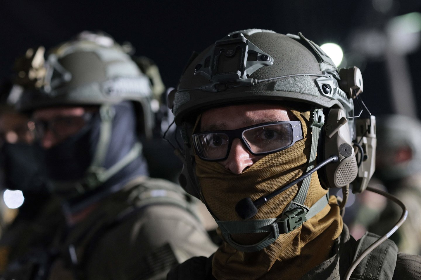 ICE pareigūnas.<br>Getty Images via AFP/Scanpix nuotr.